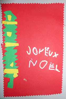 carte de Noël avec un sapin et marquée joyeux Noël