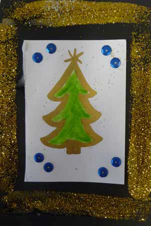 carte de Noël avec sapin central fait aux feutres et bords avec des paillettes