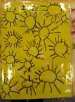 couverture de cahier avec des soleils