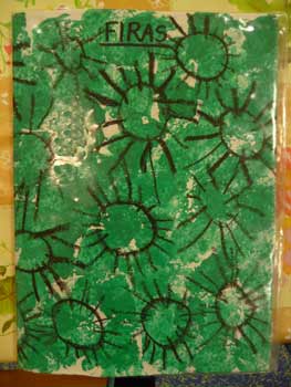couverture de cahier verte avec des soleils